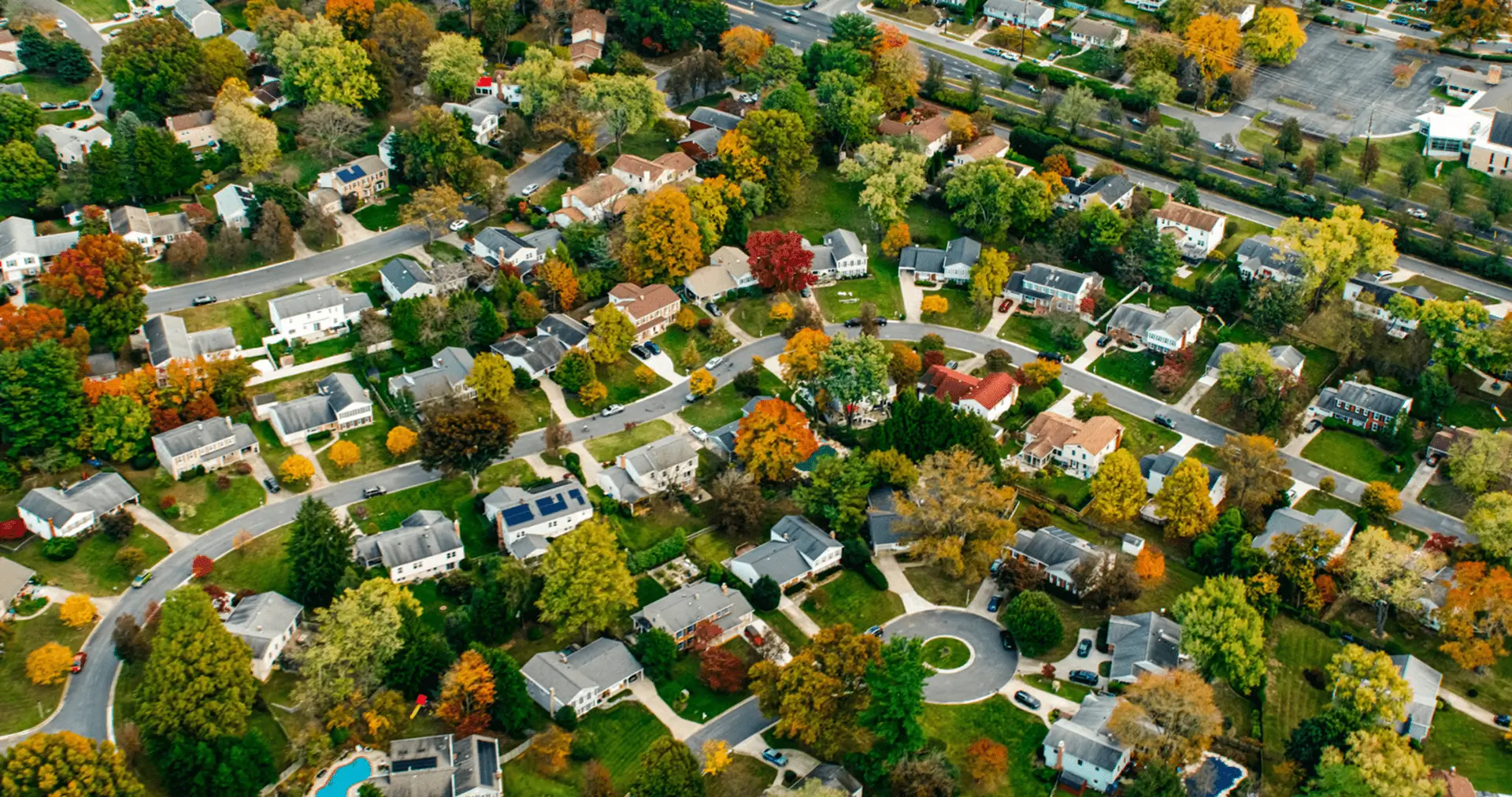 Aerial view of suburban neighborhood in autumn.